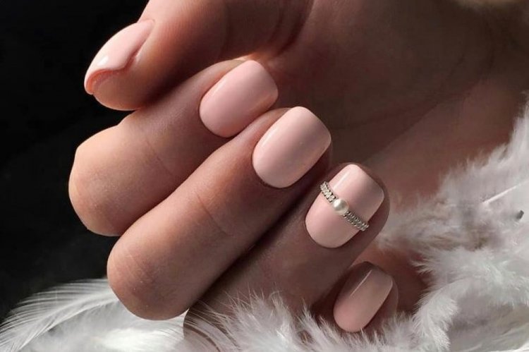 Manicure with a ring on the nail